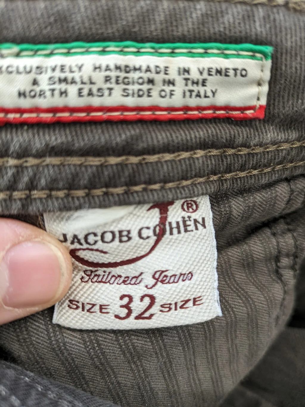 Jacob Cohen black straight jeans with leather logo patch and zip fly, size 32.