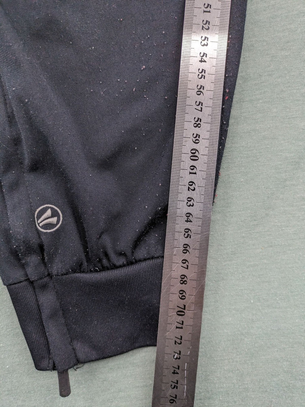 Jako black training pants size L with zippered pockets and elastic waistband.