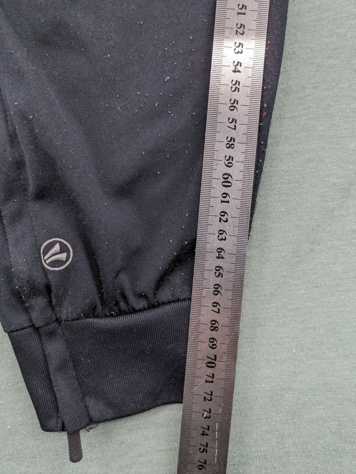 Jako black training pants size L with zippered pockets and elastic waistband.