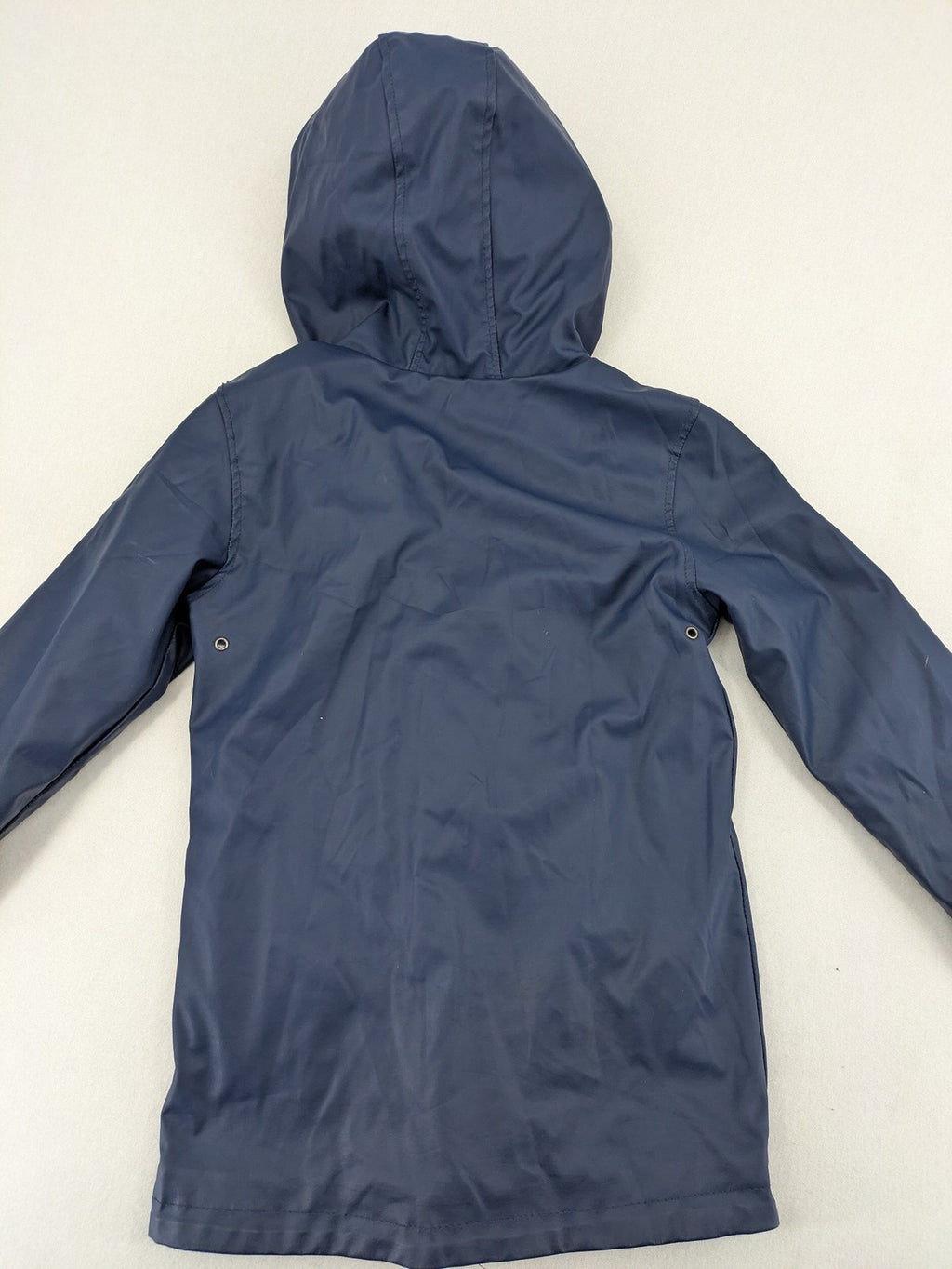 Pocopiano navy raincoat with striped lining and waterproof exterior, classic fisherman style.