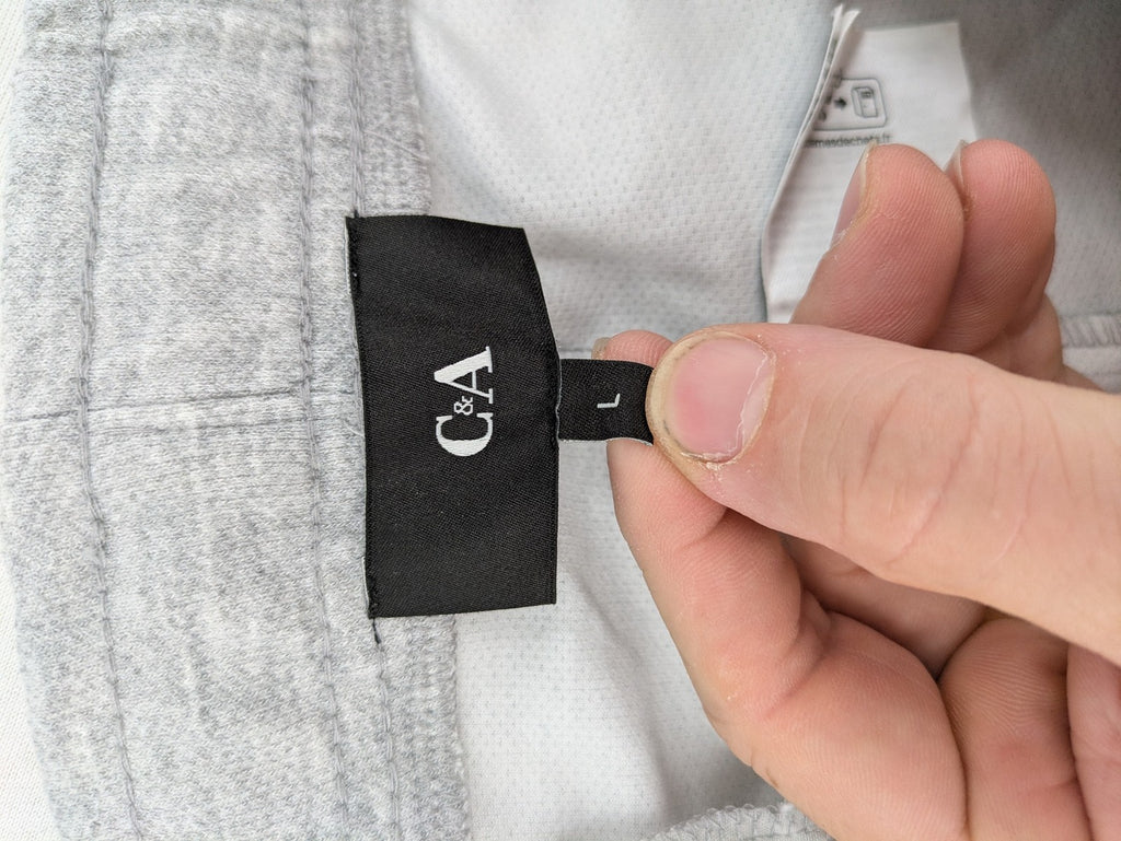 C&A grey sweatpants with elastic waistband, adjustable drawstring, and side pockets.