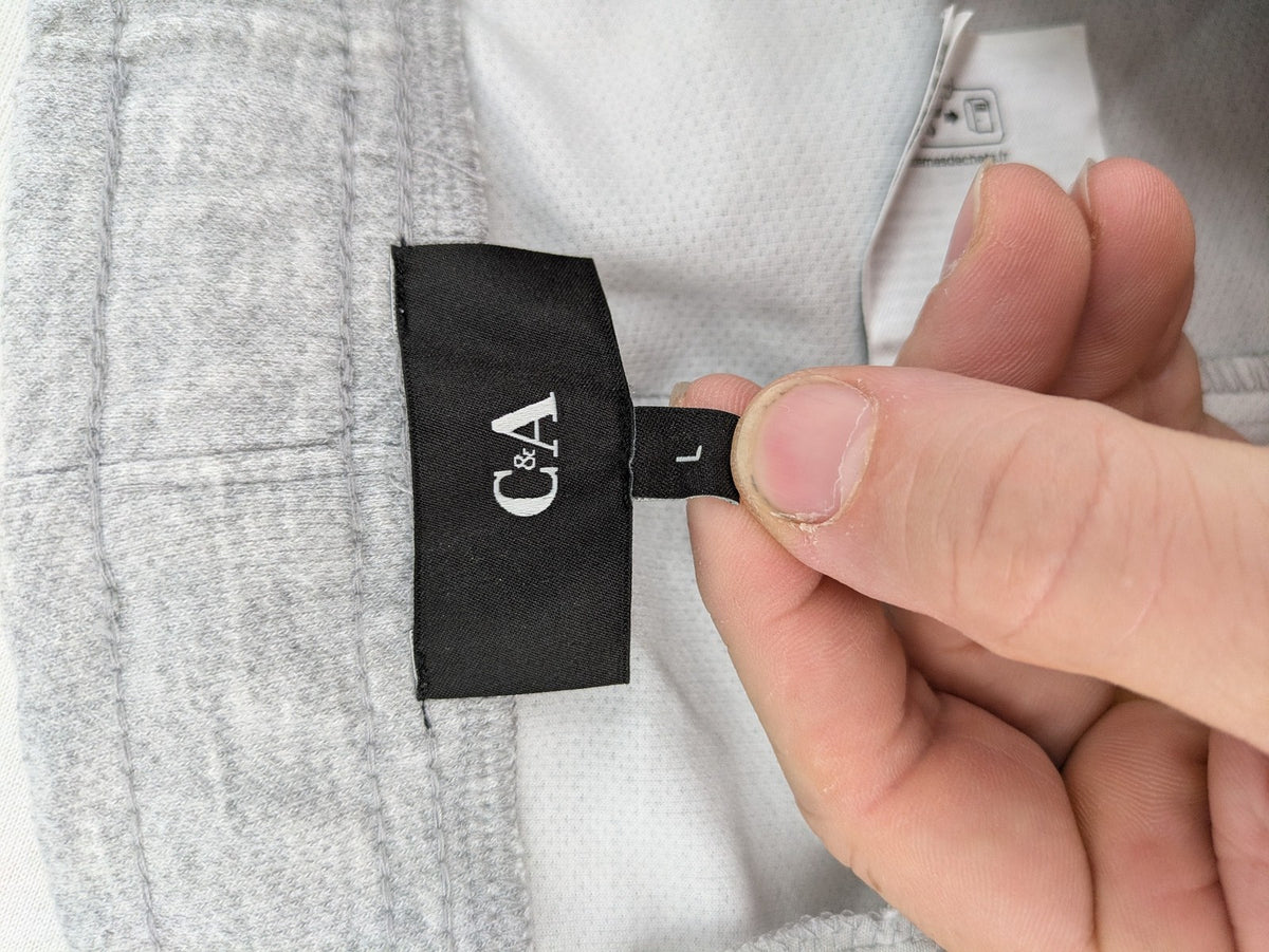 C&A grey sweatpants with elastic waistband, adjustable drawstring, and side pockets.