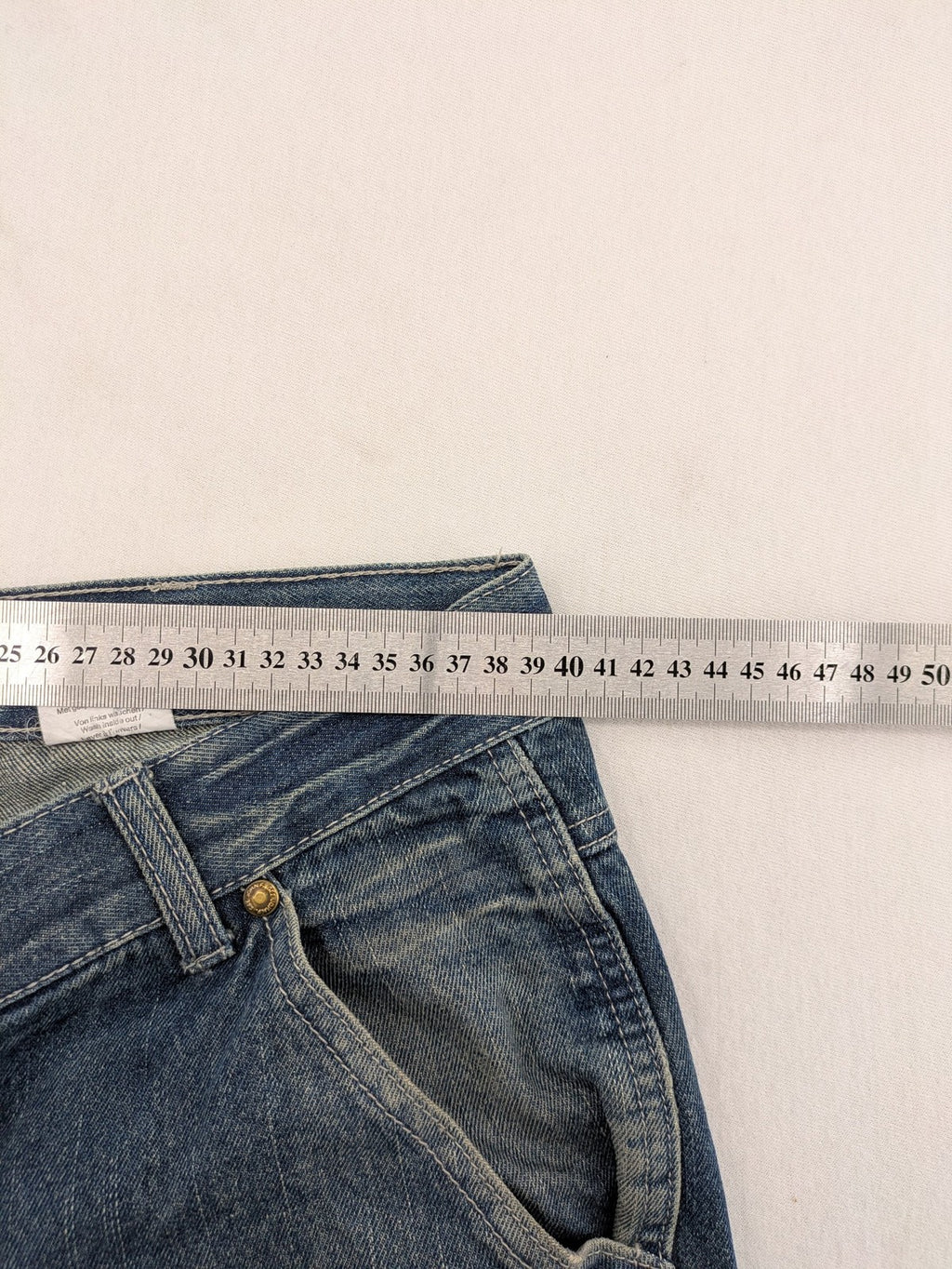 John F. Gee blue straight jeans with reinforced knees and durable denim material.