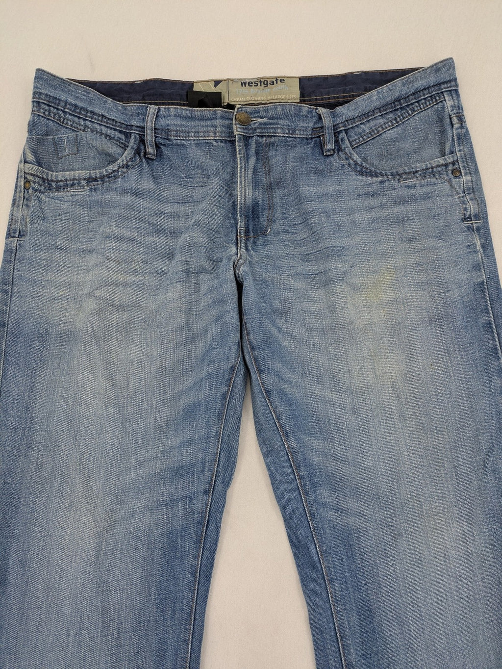 C&A blue straight jeans 5-pocket style with logo and button closure.