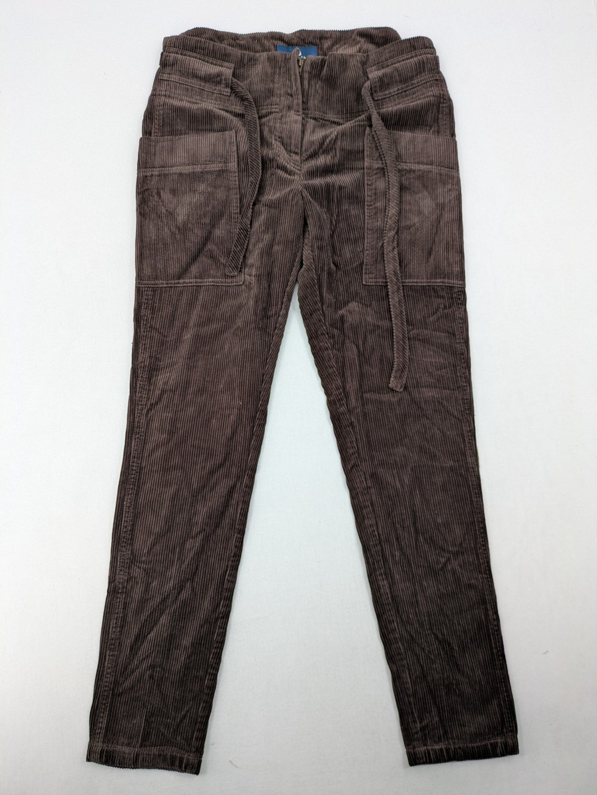 Alma & Lovis brown cord pants with drawstring, casual fit, and patch pockets.