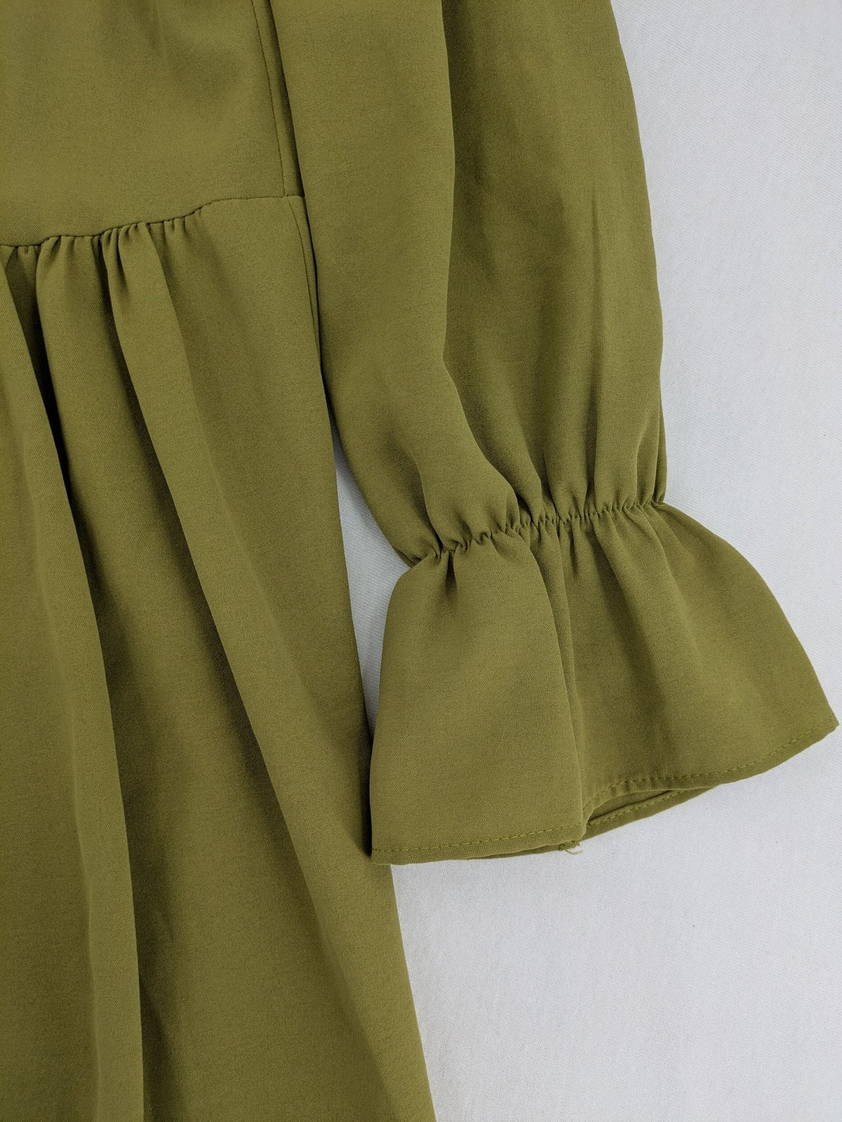Buqre Store khaki A-line dress with puff sleeves, ruffled cuffs, and button placket.