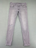 H&M grey super skinny jeans with distressed knee details and low waist fit.