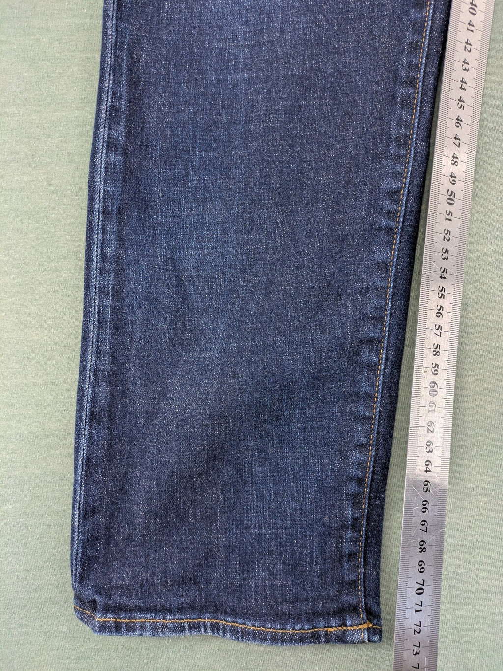 Armani Exchange blue slim fit jeans with distressed details and classic 5-pocket design.