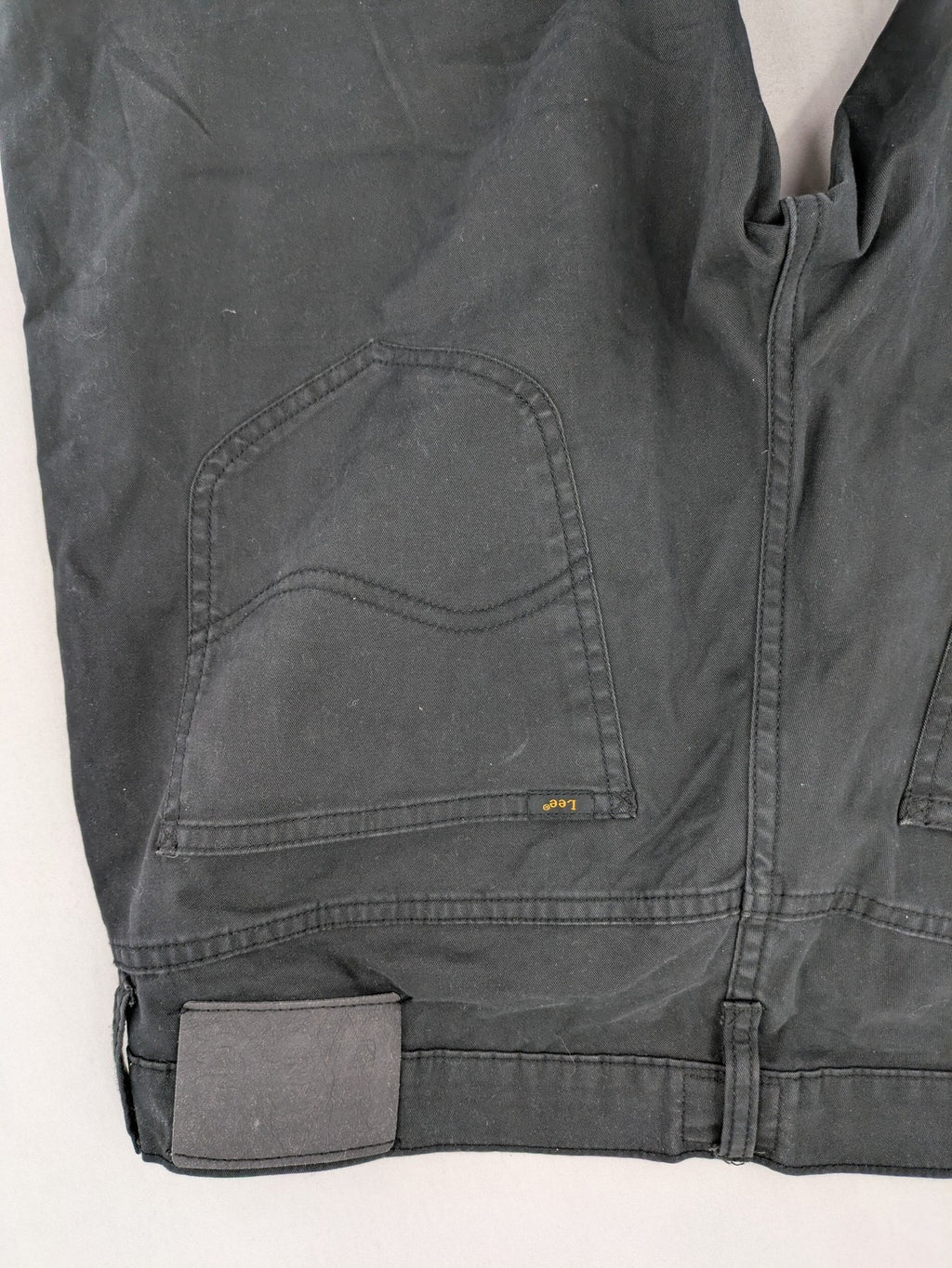 Lee straight jeans grey classic 5-pocket design with zip fly and subtle branding.