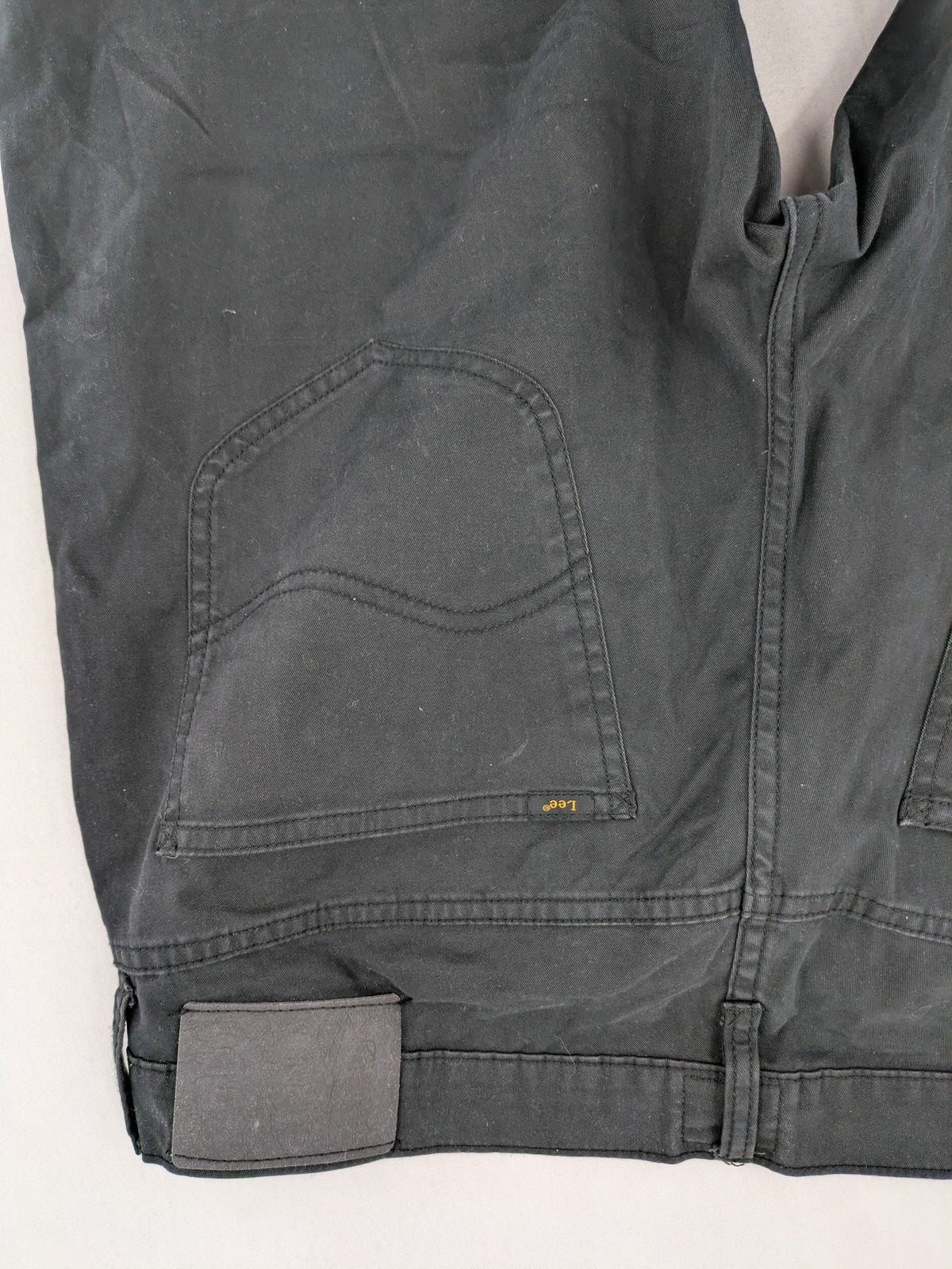 Lee straight jeans grey classic 5-pocket design with zip fly and subtle branding.