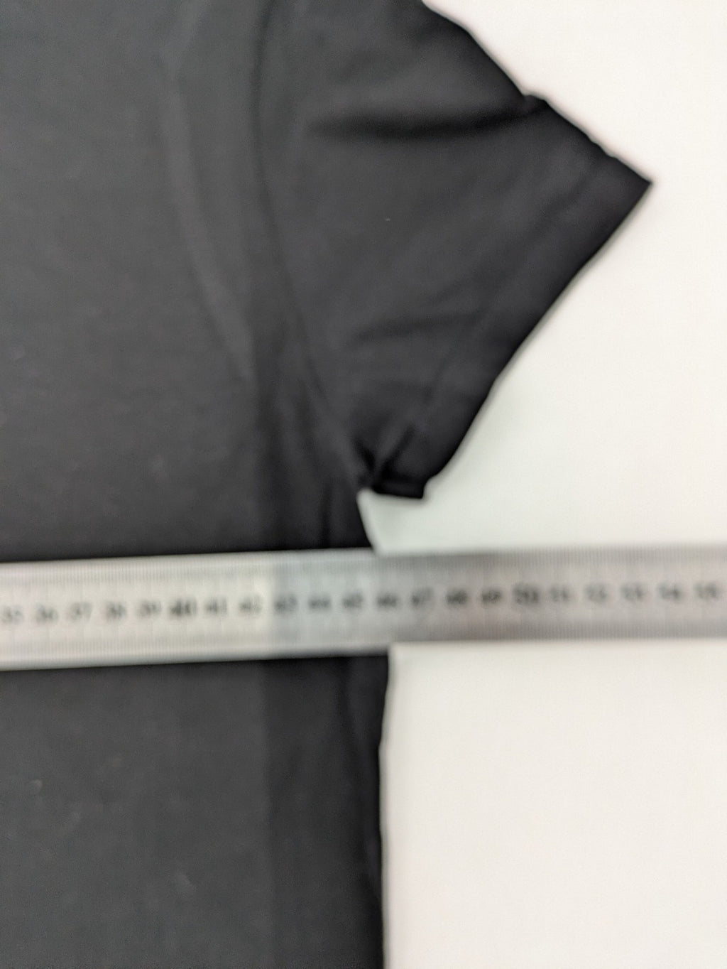 Primark black graphic t-shirt featuring yellow and white Pornhub logo on chest.