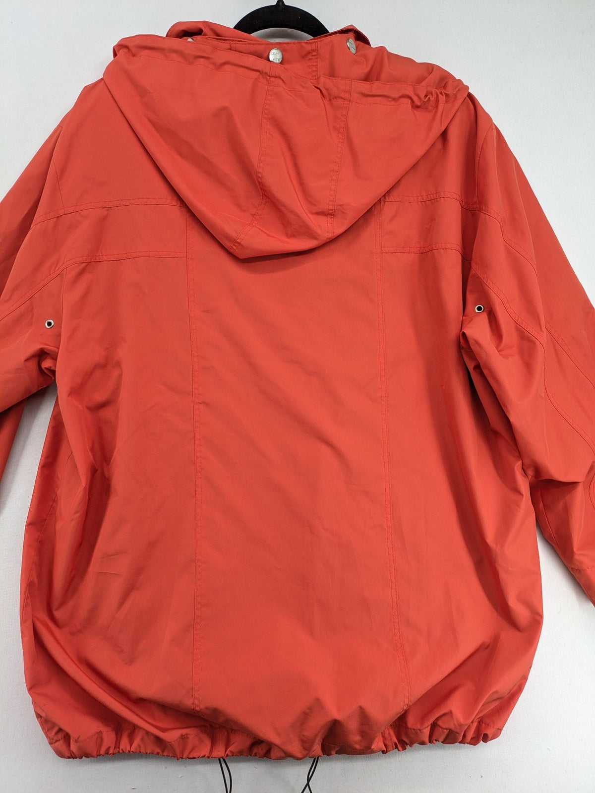 Sport Windbreaker orange jacket with adjustable hood, full zip, and button storm flap.