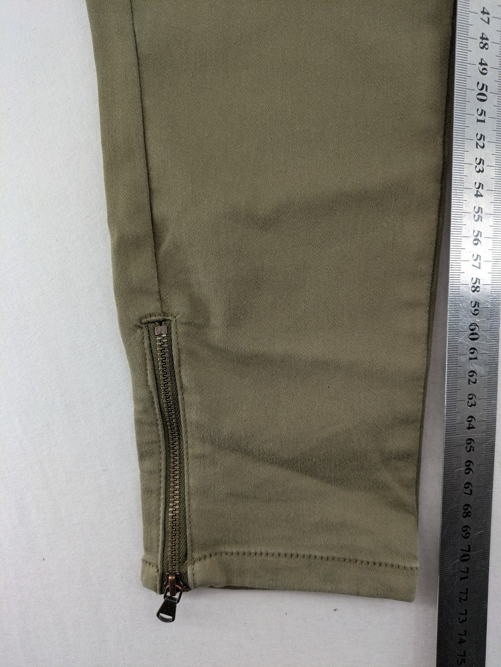 Clockhouse green moto jeggings with ribbed knee panels and ankle zippers.