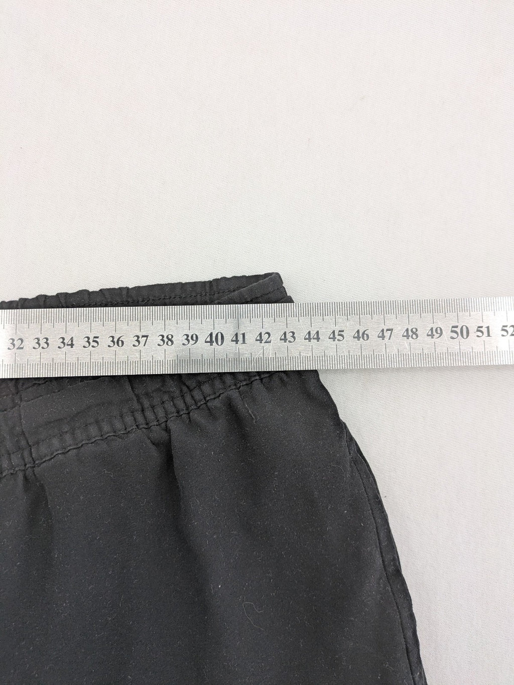Slazenger grey loungewear joggers with adjustable drawstring and subtle logo on thigh.