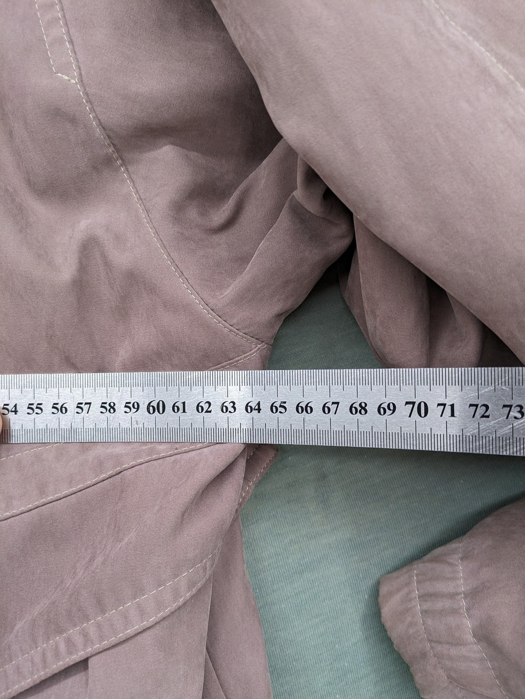 Goldix beige coat with checkered lining and Sympatex waterproof technology.
