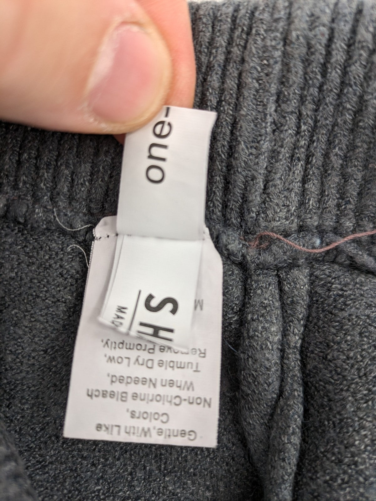 Grey pants with cable knit pattern, wide leg, ribbed waistband, 100% polyester.