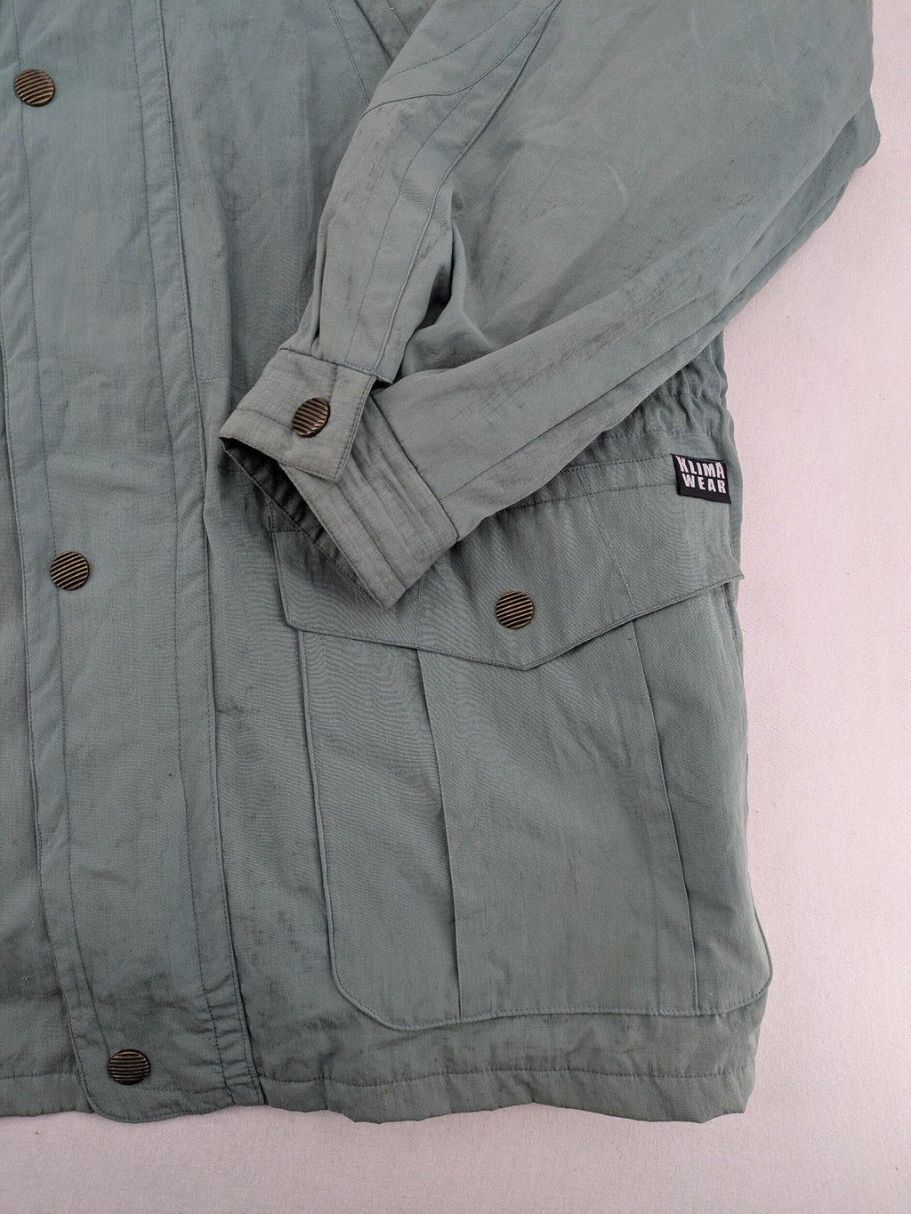 Klima green jacket vintage style, windproof, waterproof, with hidden hood and multiple pockets.