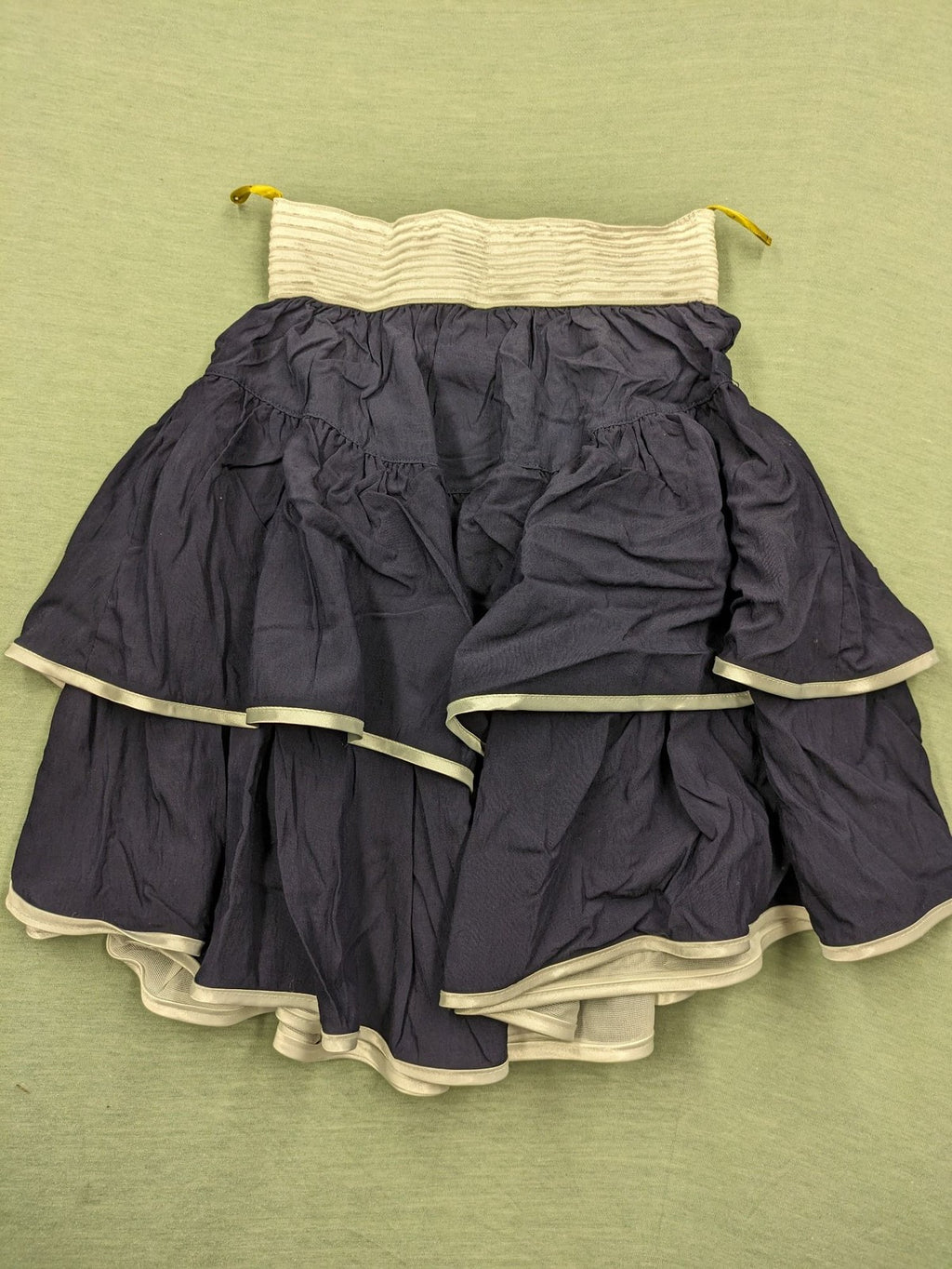 C&A knee-length skirt cream and navy, high waist with tiered ruffles and gold buttons.
