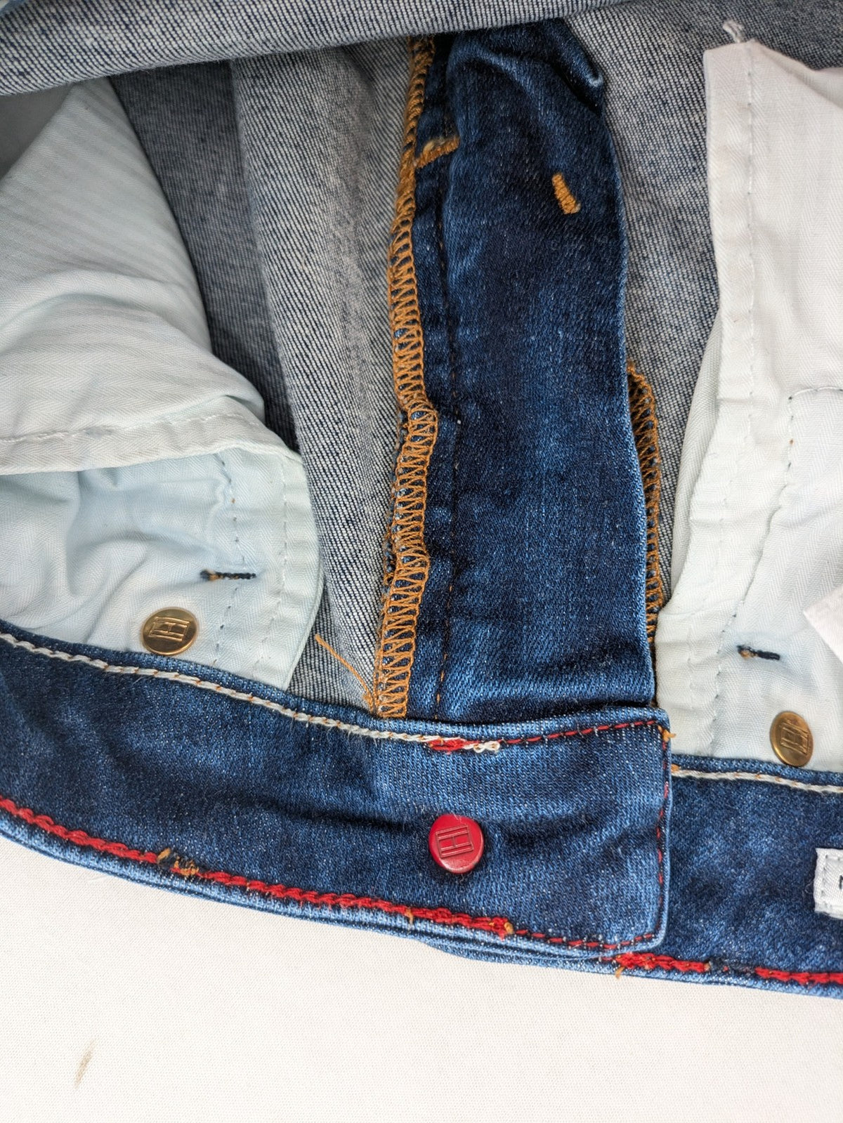 Tommy Hilfiger blue skinny jeans, five-pocket design, made from organic cotton blend.