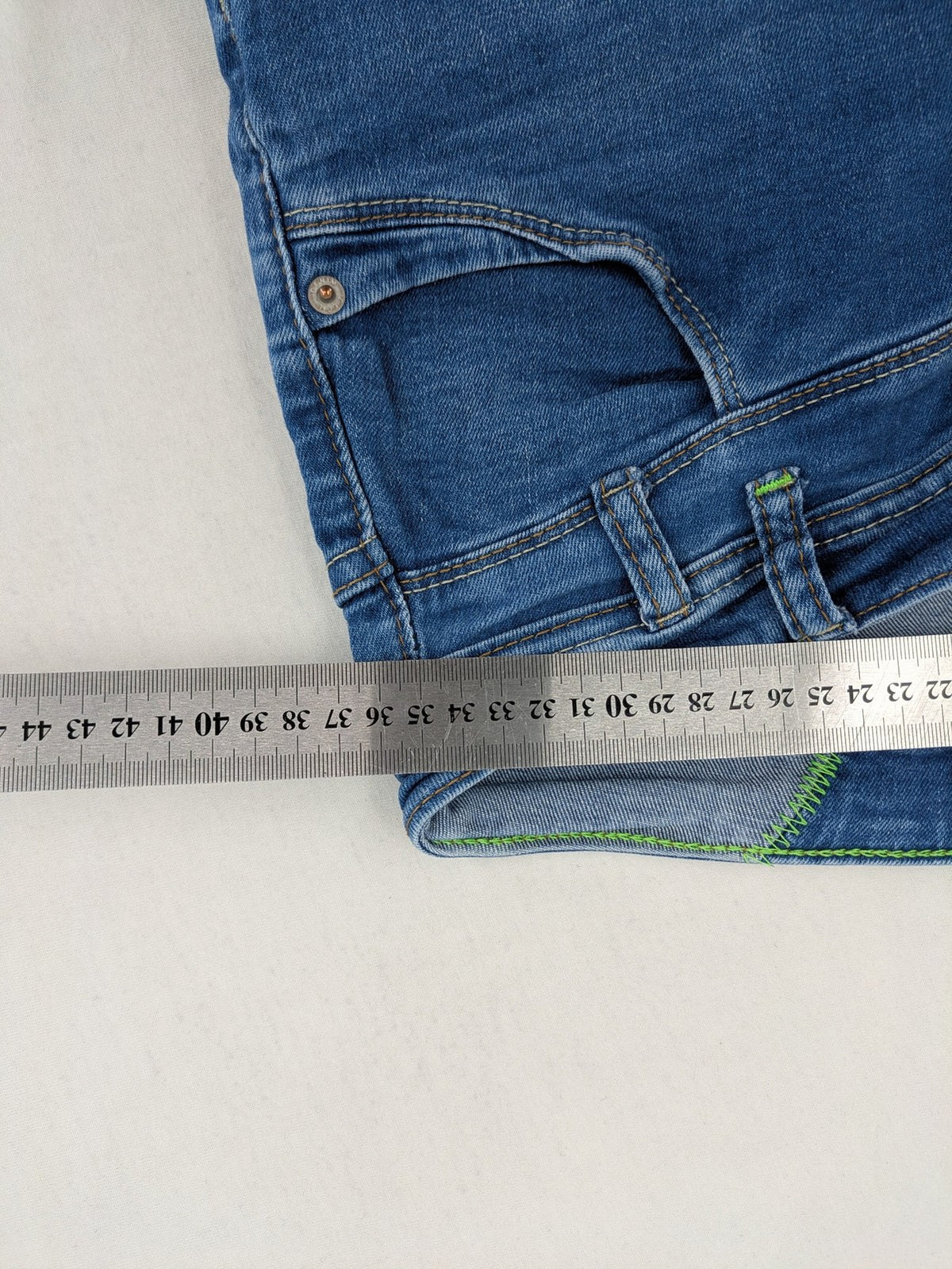 Cecil blue straight jeans with neon green accents and classic 5-pocket design.