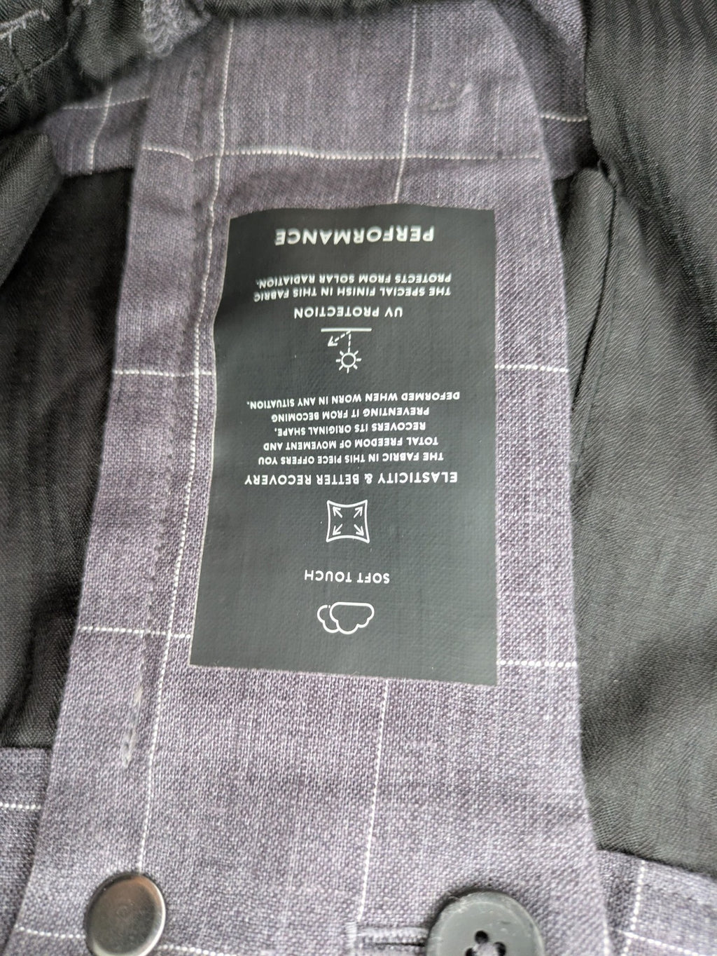MNG Man grey plaid pants with rolled hem and stretch performance material.