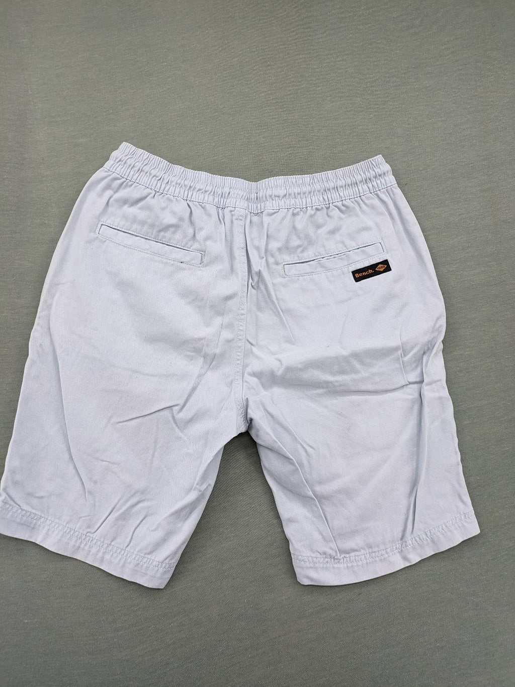 Bench blue shorts with elastic waistband, drawstring, and multiple pockets.
