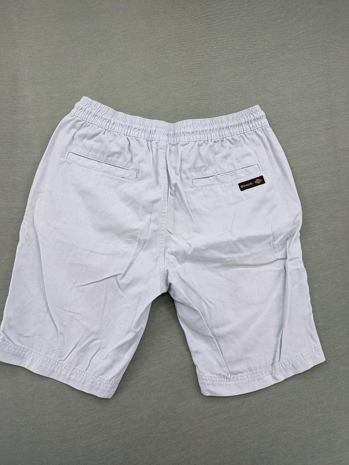 Bench blue shorts with elastic waistband, drawstring, and multiple pockets.