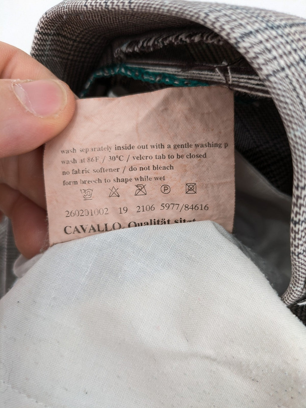 Cavallo grey check riding pants with brown full-seat patch and logo detail.
