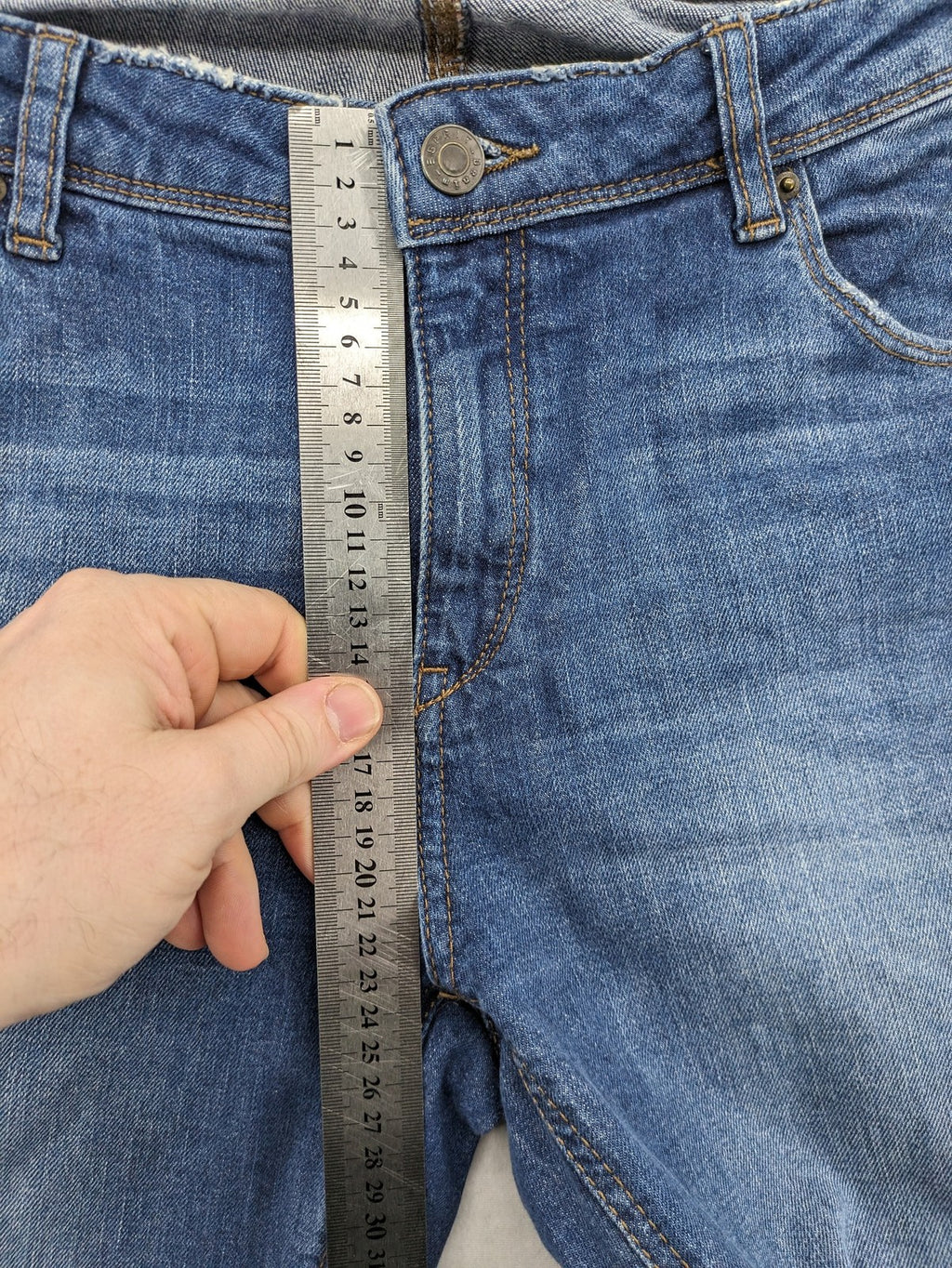 Esprit blue straight leg jeans with ripped knee details and rolled hem.