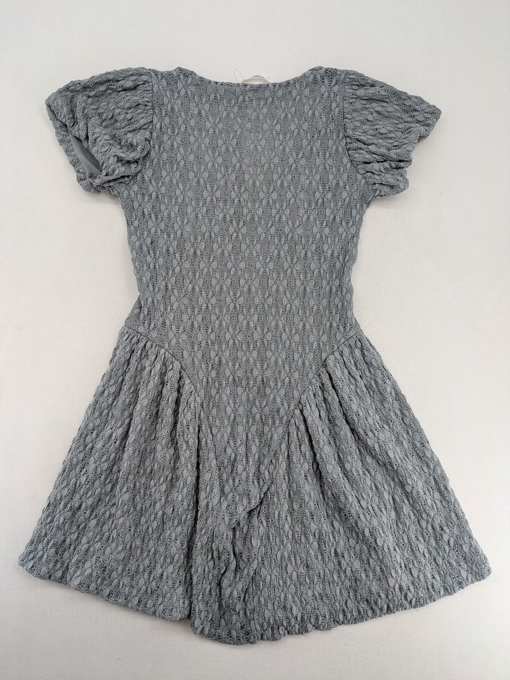 Zara grey mini dress with V-neck, puff sleeves, and textured fabric pattern.