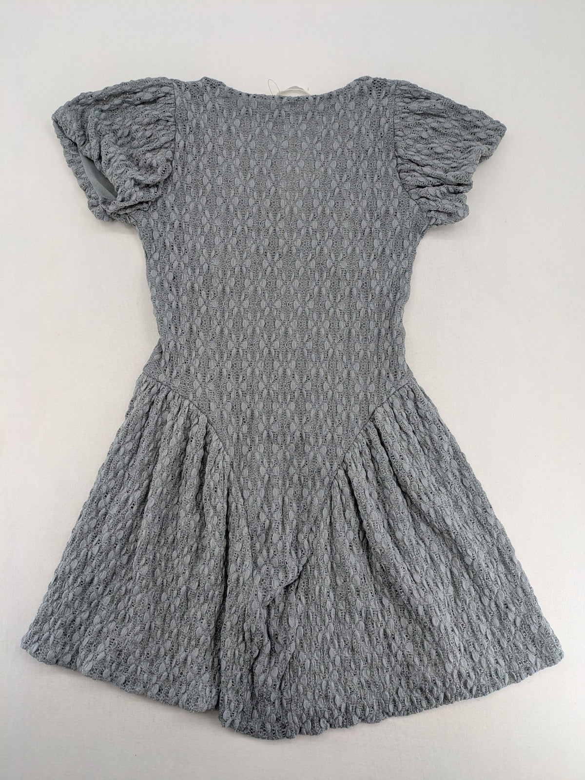 Zara grey mini dress with V-neck, puff sleeves, and textured fabric pattern.