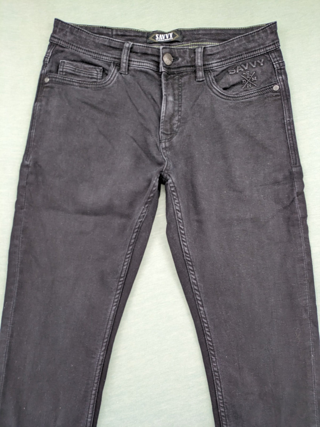 Savvy black straight jeans with washed finish and slim fit, made from stretch denim.