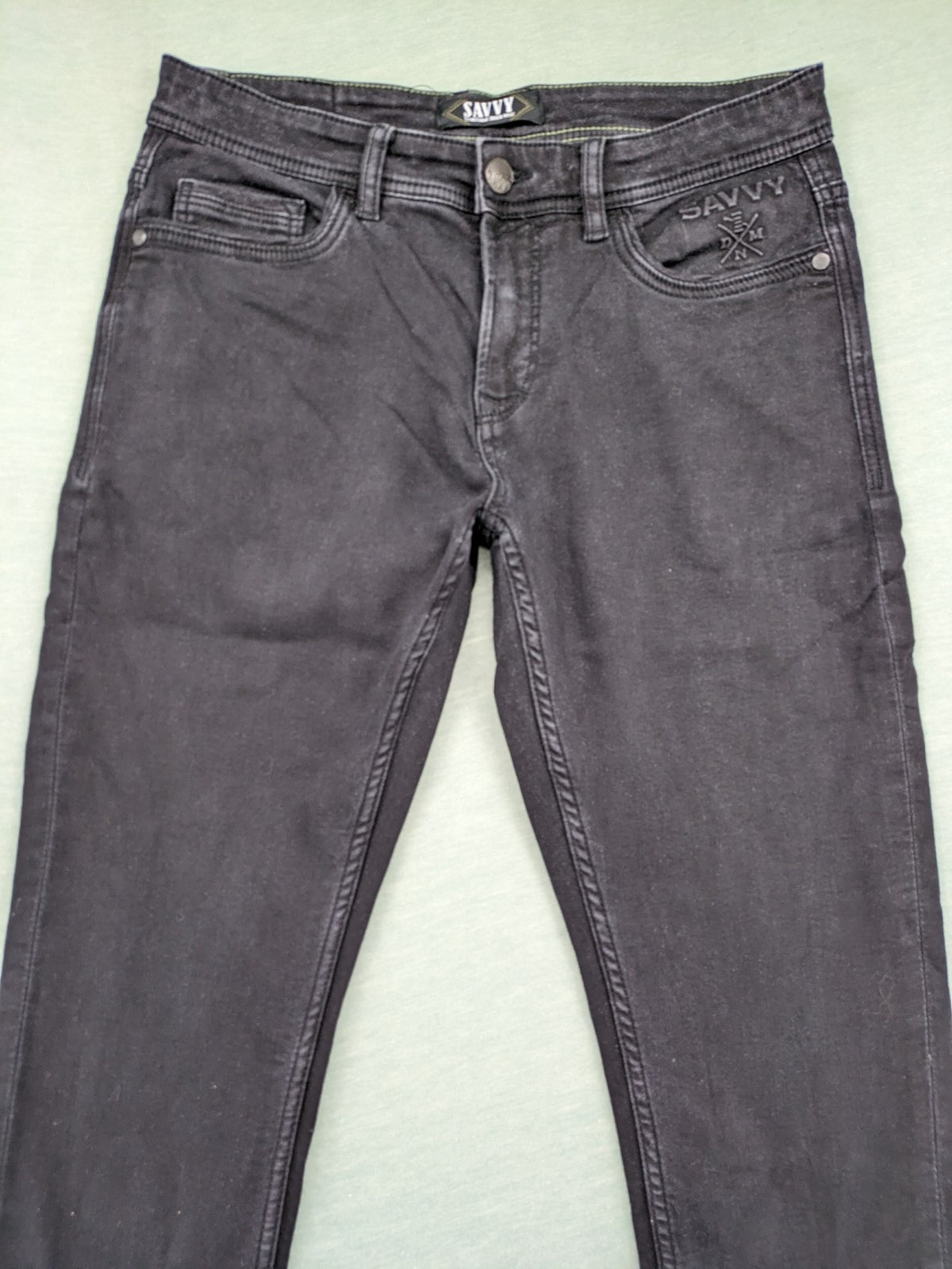 Savvy black straight jeans with washed finish and slim fit, made from stretch denim.