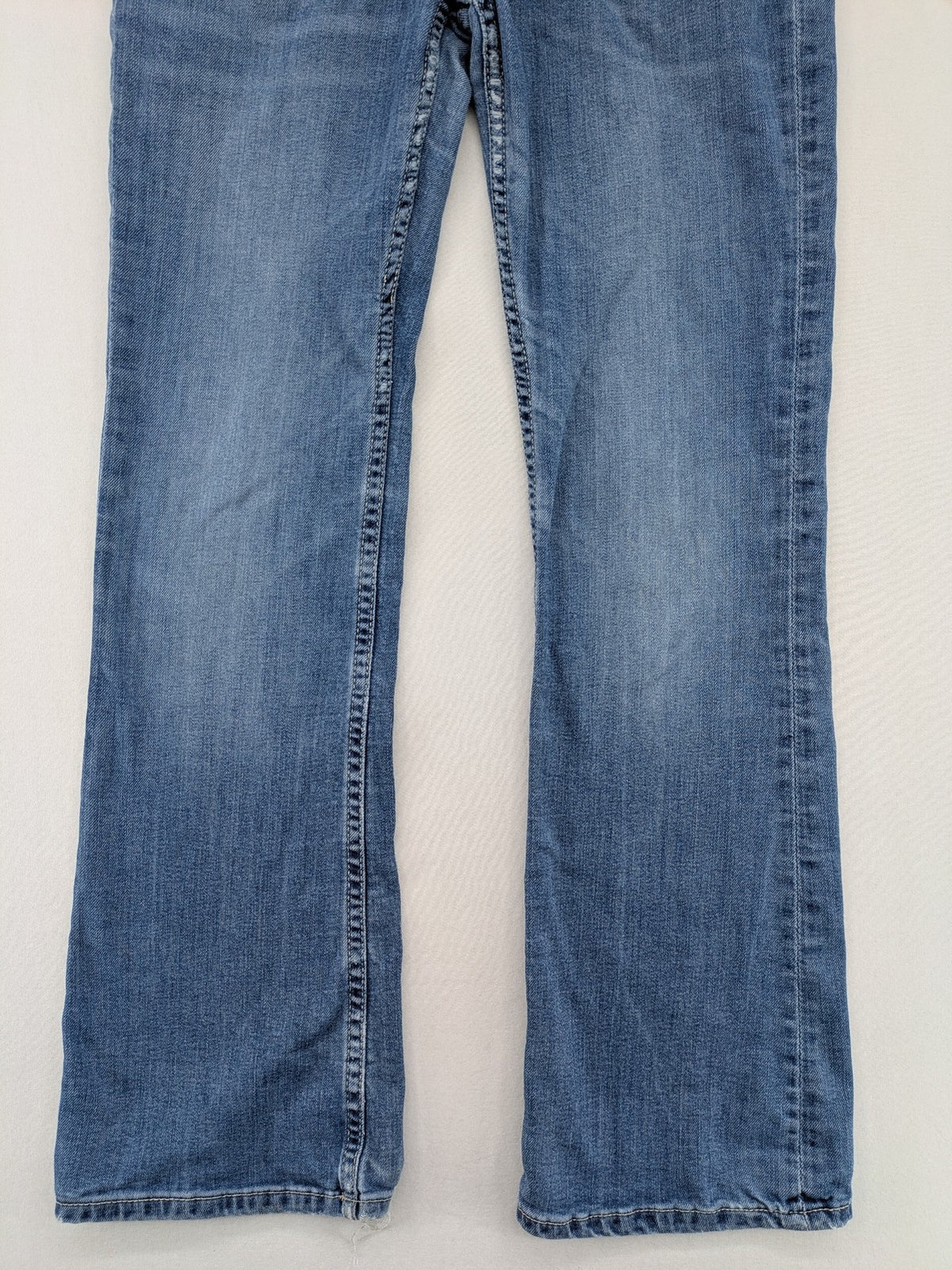 H&M blue bootcut jeans size 146, medium wash, stretch denim material.