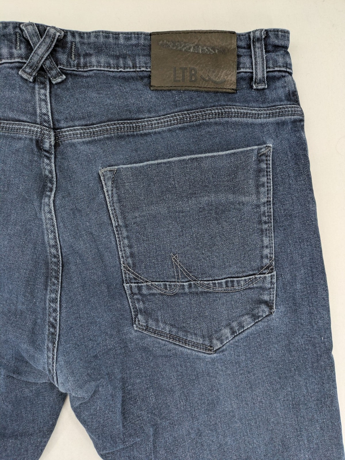 LTB blue straight jeans Joshua model with low rise slim fit and stretch denim.