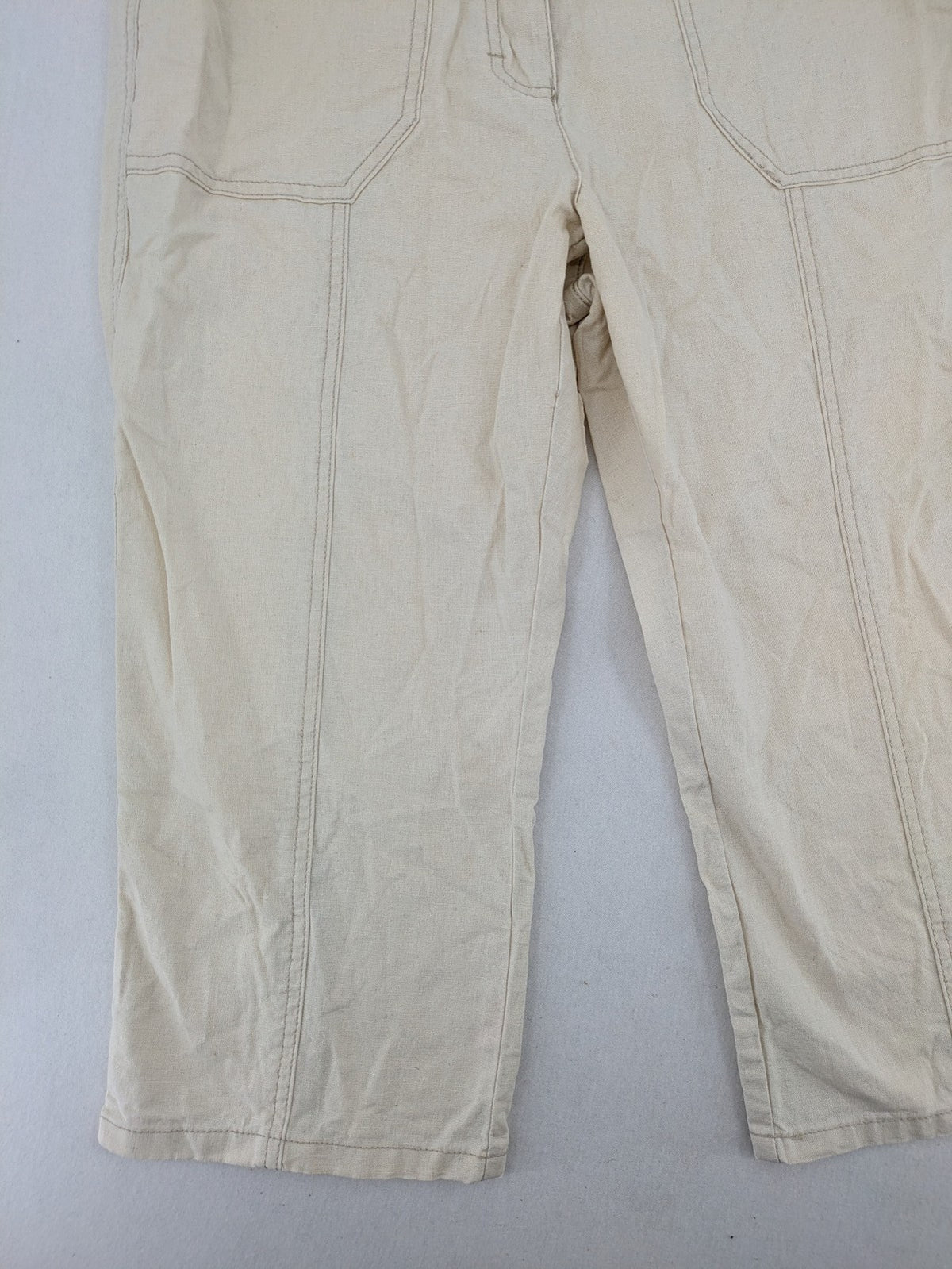 Marco Pecci beige capri pants with prominent seam details and practical pockets.