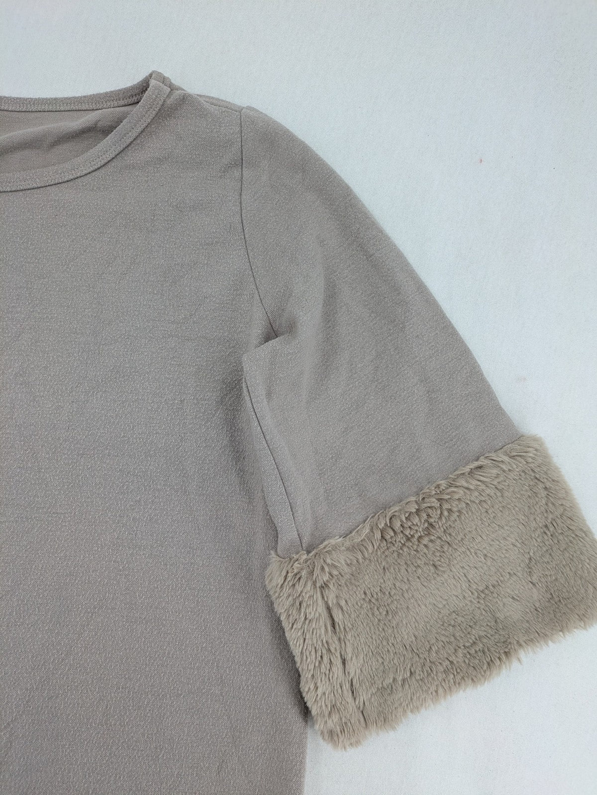 Alba Moda beige turtle neck jumper with plush faux fur cuffs and 3/4 sleeves.