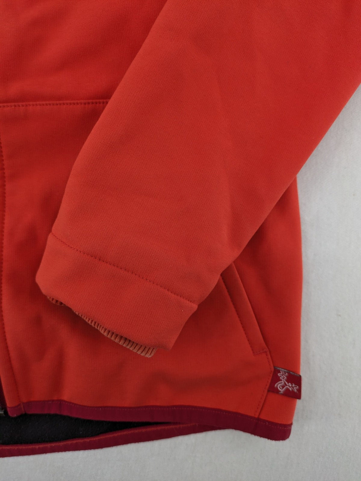 elkline orange softshell coat with fleece lining and elk logo patch