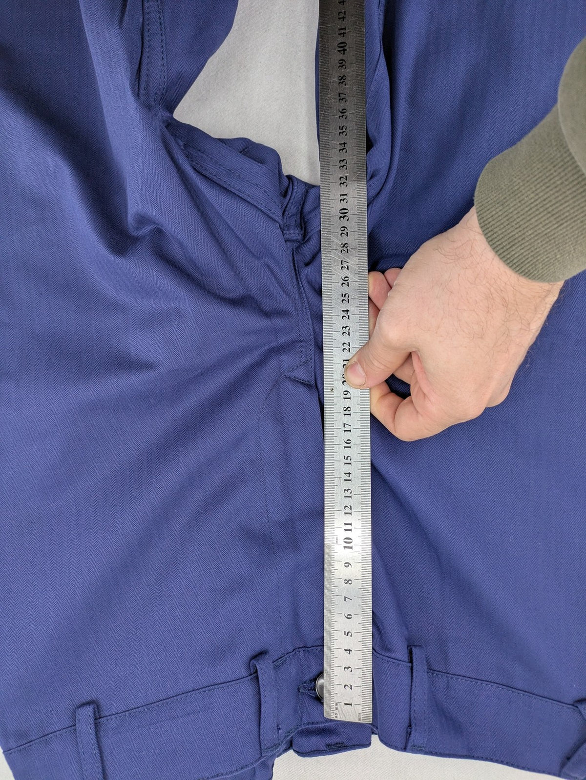 Uvex navy work trousers 100% cotton with button closure and belt loops.