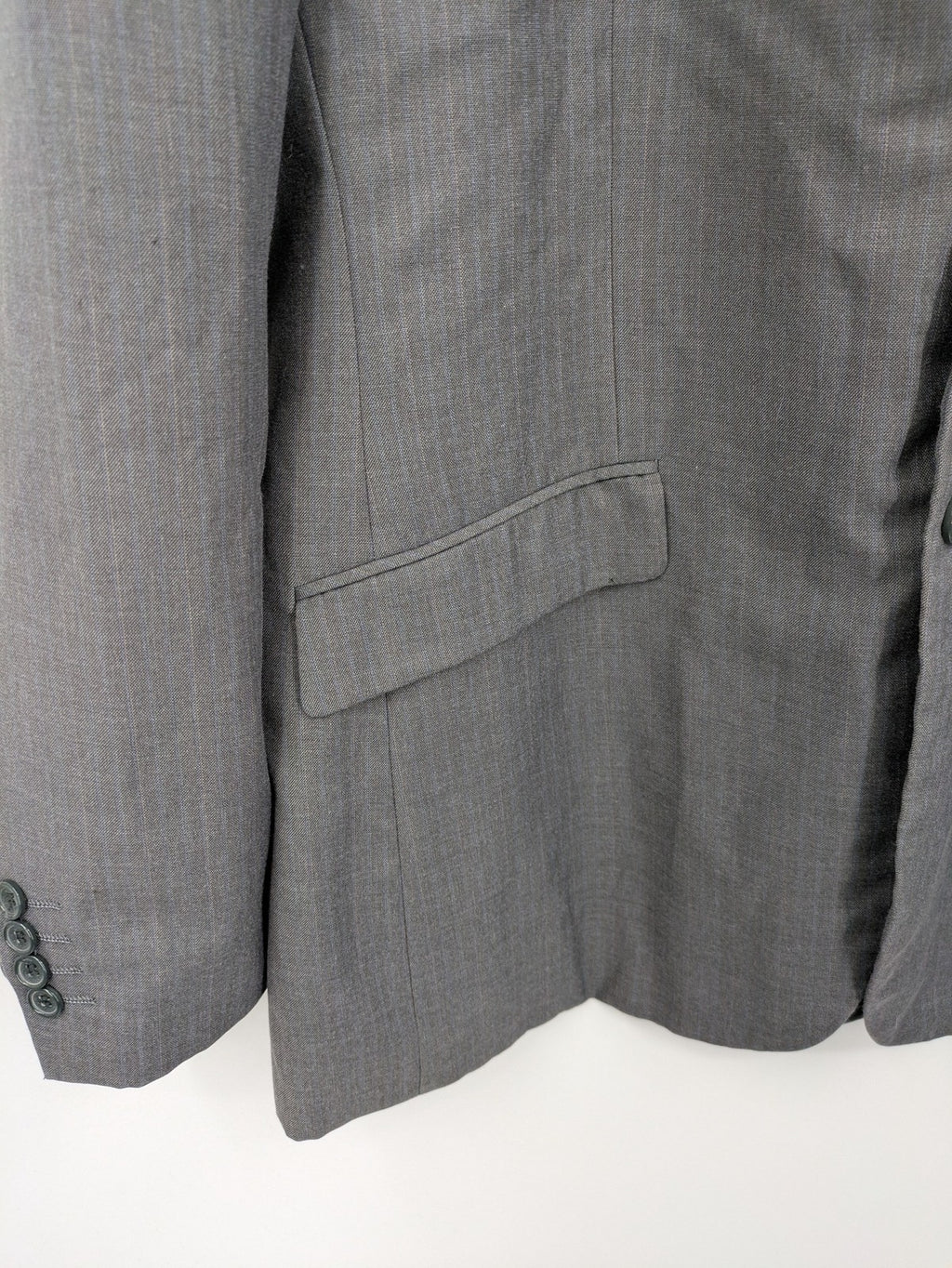 Alextrading grey jacket with subtle light blue pinstripe pattern and notch lapels.