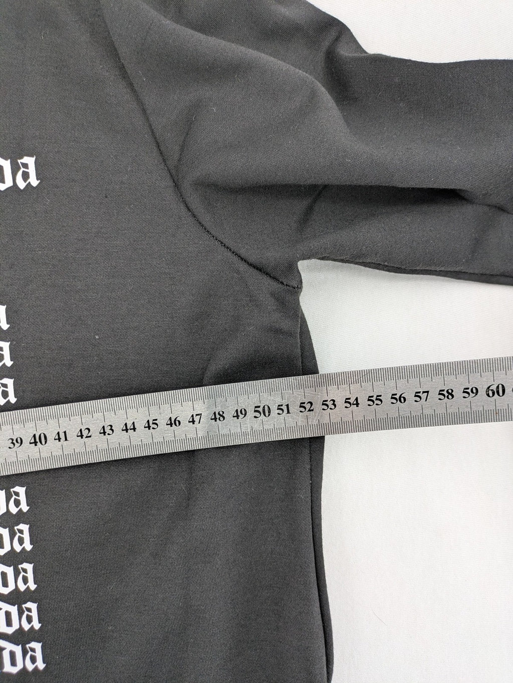 Sixth June black sweatshirt with Gothic "Propaganda" graphic print and logo details.