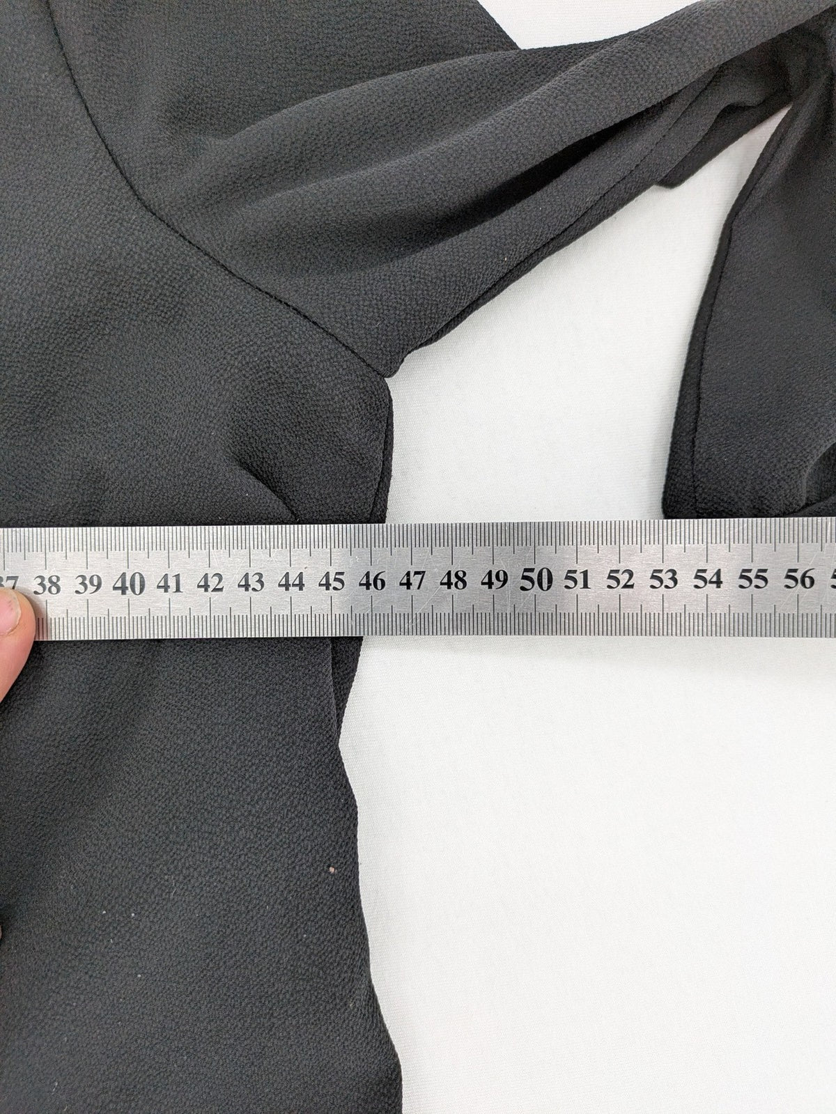 Infinity grey bridal party dress with pleated front and 3/4 sleeves.