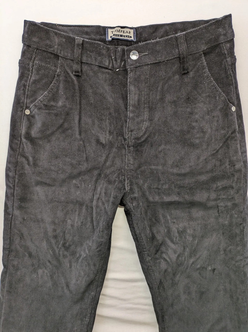 Tomfear black straight fit cord jeans, classic five-pocket design, soft corduroy material.