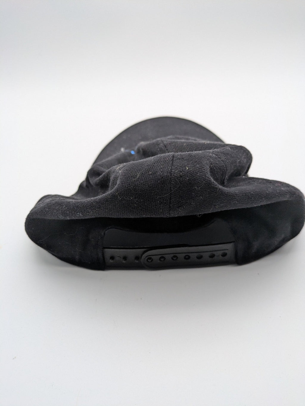Quantum black snapback cap with bright blue embroidered logo and adjustable snapback closure.