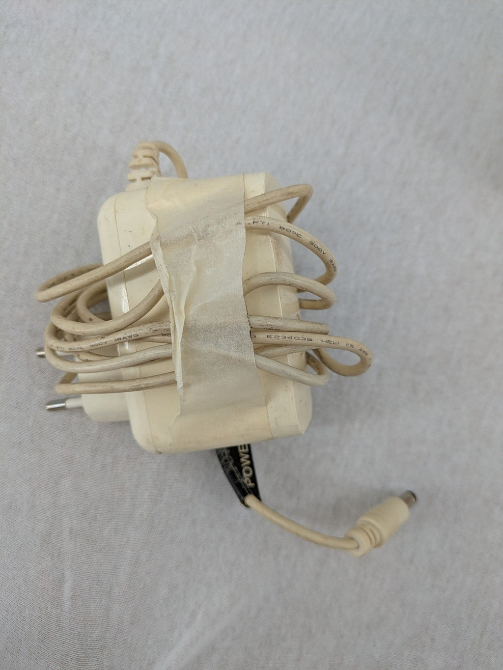 Vodafone beige wireless router with multiple LAN ports and DSL connectivity.
