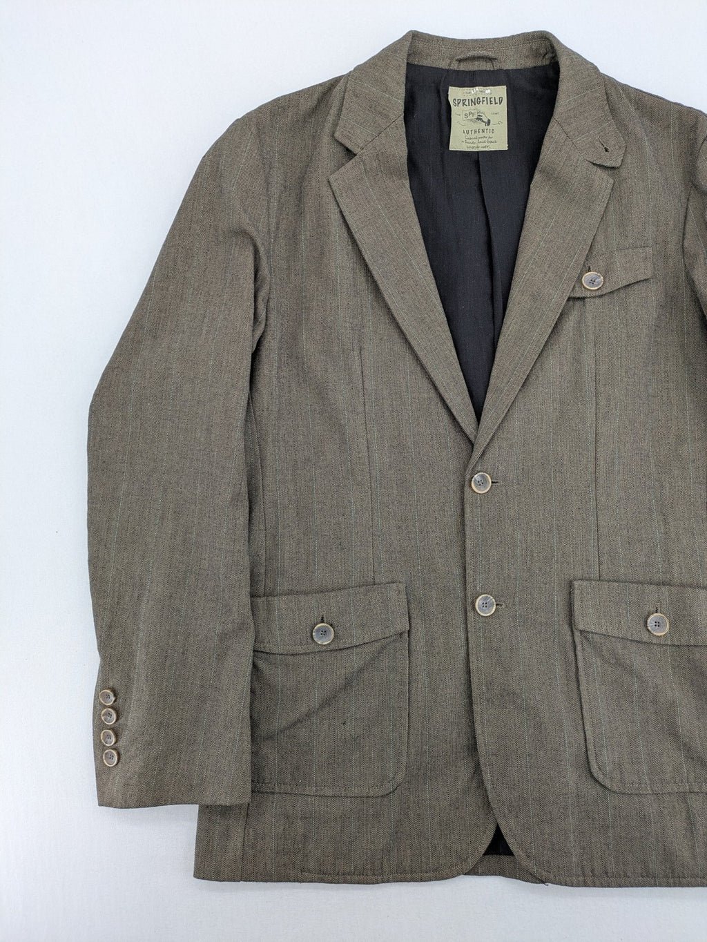 Springfield pink blazer with subtle pinstripe pattern and patch pockets.
