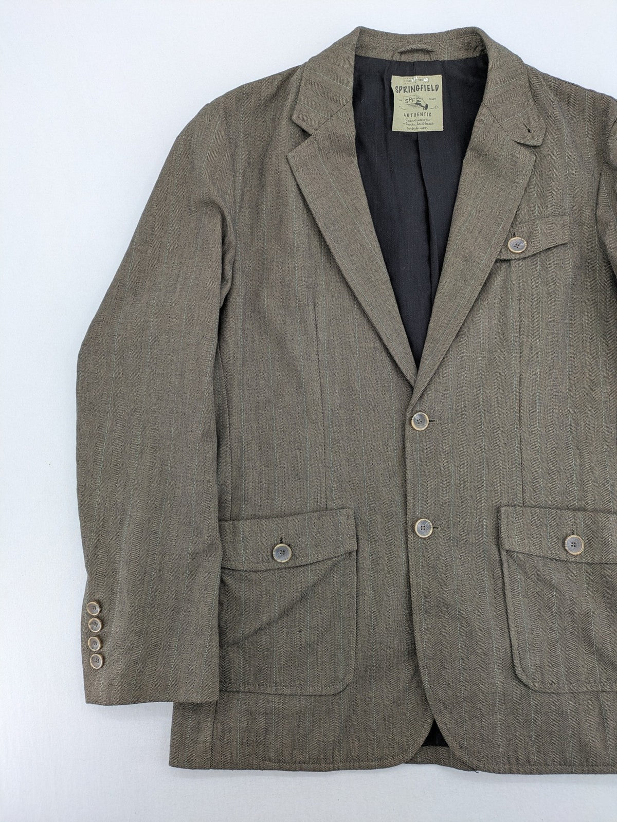 Springfield pink blazer with subtle pinstripe pattern and patch pockets.