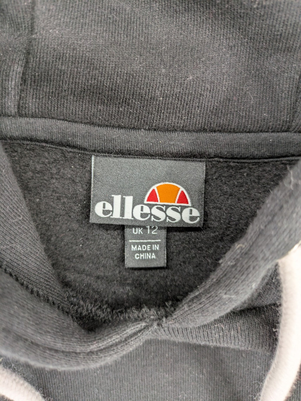 Ellesse grey hoodie with large logo, kangaroo pocket, and drawstring hood.