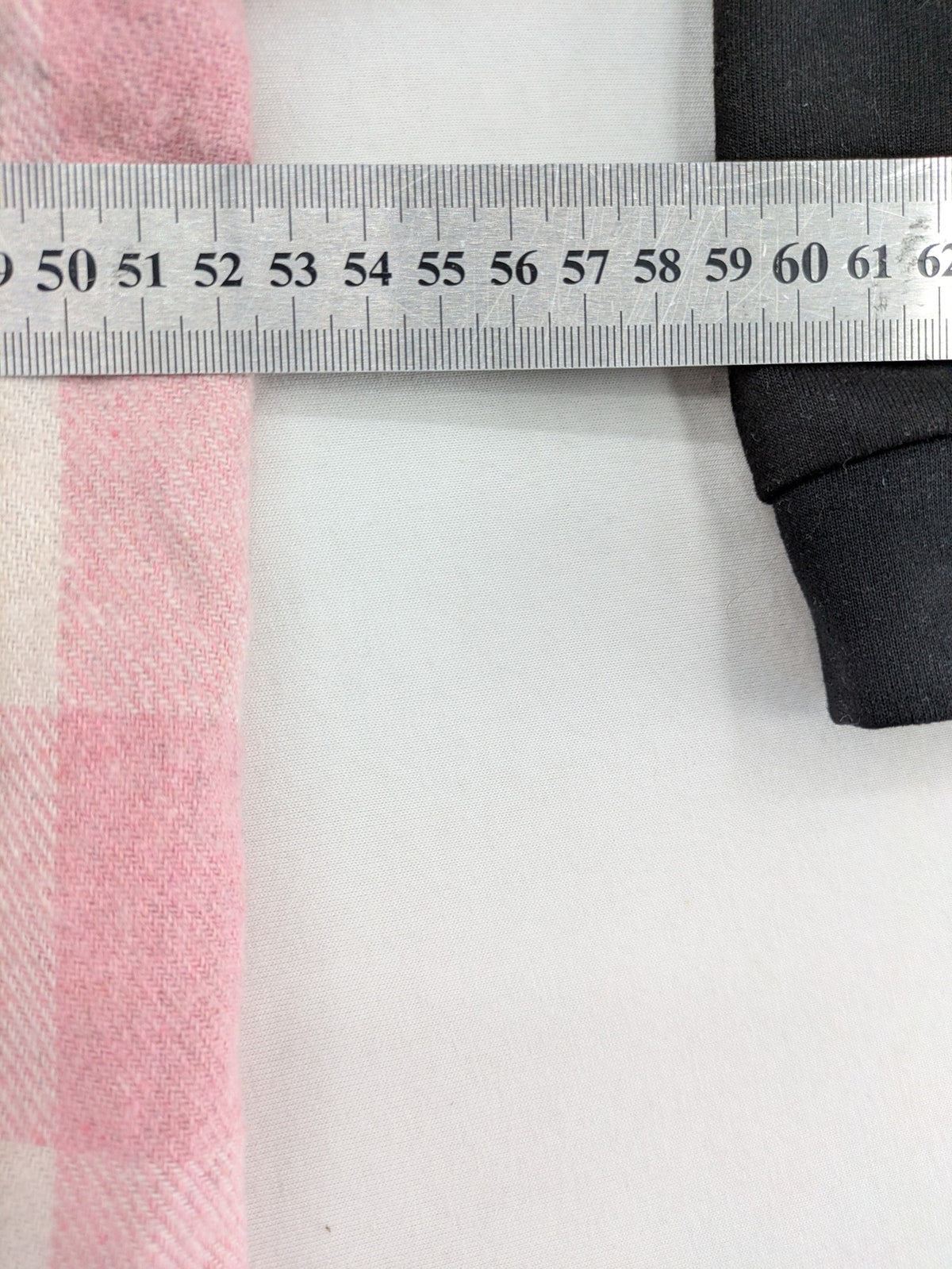 L'ange pink hoodie dress with black body and contrasting pink-white checkered panels.