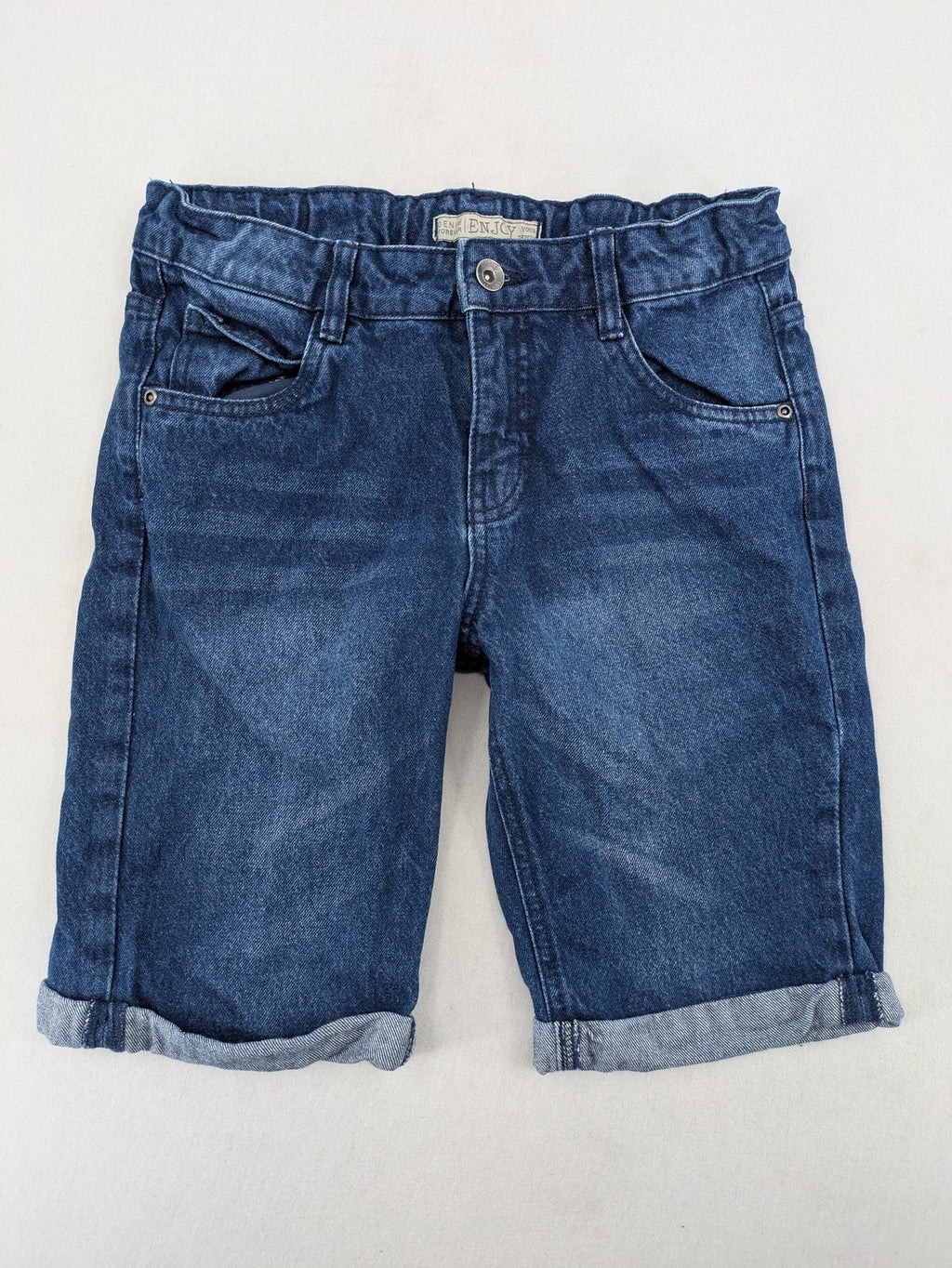 Pocopiano blue denim shorts with rolled cuffs and elastic waistband for comfort.